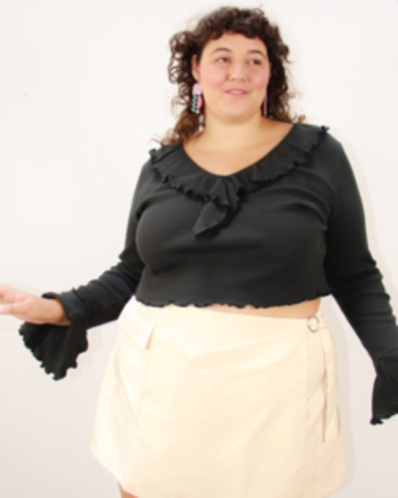 Front of a model wearing a size L Dazed Ruffled Top in Black by Lovefool. | dia_product_style_image_id:249610
